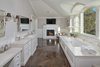Modern home with Bath Room. A second master bathroom replete with herringbone floors, a fireplace, and marble finishes. Photo 7 of Old Hollywood Glamour With Modern Appeal in Bel Air