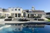 Modern home with Outdoor. Phenomenal grounds include an exquisite swimming pool and spa, ample lounge areas, and lighted, mature trees all set against a backdrop of the Bel Air Country Club golf course. Photo 9 of Old Hollywood Glamour With Modern Appeal in Bel Air