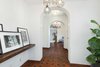 Modern home with Hallway and Ceramic Tile Floor. Period charm meets contemporary sophistication. Photo 5 of A Reimagined Spanish Hideaway in the Hollywood Hills
