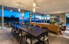 Modern home with Dining Room, Ceiling Lighting, Light Hardwood Floor, Table, Accent Lighting, and Chair. The home’s sliding glass walls blend organically into expansive grounds.
Photo 4 of An Architectural Gem on the Bird Streets of Los Angeles