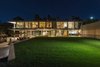 Modern home with Outdoor, Back Yard, Trees, and Large Patio, Porch, Deck. Living spaces assume an artful glow at dusk. Photo 11 of An Architectural Gem on the Bird Streets of Los Angeles