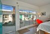 Modern home with Bedroom. Expansive windows open to the courtyard. Photo 6 of An Award-Winning Midcentury Modern Hotel & Spa Hits the Market