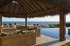 Modern home with Outdoor. The poolside, palapa terrace captures unending ocean views. Photo 8 of Modern Mexican Retreat Casa Grillo Stuns From An Ocean-View Hillside