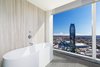 Modern home with Bath Room. A free-standing tub with sweeping city views. Photo 5 of Two-Story Penthouses Atop Metropolis Bring All of Los Angeles Into View