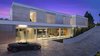 A 78' water feature lines the stately motor court. Photo 2 of An Architectural Masterpiece Shines Above the Bel Air Golf Course modern home