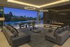 The great room with striking fire feature. Automatic glass doors offer a seamless flow to expansive outdoor entertaining areas. Photo 3 of An Architectural Masterpiece Shines Above the Bel Air Golf Course modern home