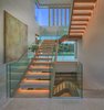 The striking, floating staircase with LED-lit steps. Photo 5 of An Architectural Masterpiece Shines Above the Bel Air Golf Course modern home
