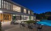 The pool terrace is perfect for al fresco dining. Photo 9 of An Architectural Masterpiece Shines Above the Bel Air Golf Course modern home