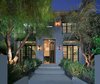 A lit walkway lined with mature pepper and olive trees leads to the 3,538-square-foot residence. Photo of A Newly Built Architectural Estate Dazzles in L.A.’s Beverly Grove modern home