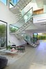 The home's polished steel, floating double staircase is a work of art. Photo 2 of A Newly Built Architectural Estate Dazzles in L.A.’s Beverly Grove modern home