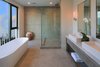 The master bath features dual sinks, a large soaking tub and gorgeous views. Photo 7 of A Newly Built Architectural Estate Dazzles in L.A.’s Beverly Grove modern home