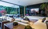 Open-plan interiors feature soaring ceilings and automatic pocket doors for an effortless indoor-outdoor flow to the exceptional grounds beyond. Photo 2 of An Unprecedented Architectural Estate in Beverly Hills Asks $39.5 Million modern home