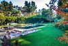 Flat, rolling lawns surround a resort-caliber pool with Baja shelf, spa and numerous fire and water features. Photo 7 of An Unprecedented Architectural Estate in Beverly Hills Asks $39.5 Million modern home