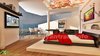 Modern home with Bedroom, Bed, Dresser, Wardrobe, Night Stands, Shelves, Storage, Ceiling Lighting, Bookcase, Light Hardwood Floor, Table Lighting, and Medium Hardwood Floor. Awesome 3D Bedroom View Concept Photo of Stunning Classic Bedroom Concept