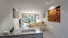 Modern home with Kitchen, Granite Counter, White Cabinet, Wood Cabinet, Marble Counter, Laminate Counter, Light Hardwood Floor, Medium Hardwood Floor, Ceramic Tile Backsplashe, Glass Tile Backsplashe, Ceiling Lighting, Refrigerator, Wall Lighting, Pendant Lighting, Microwave, and Vessel Sink. Beautifully Designed 3D Bold White Kitchen CGI Photo 7 of Beautifully Bold 3D Interior Kitchen Design View - California, USA