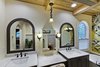 his & hers vanities with makeup station in between Photo 11 of Tuscan Retreat modern home