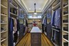 Wood-Mode custom closet system Photo 18 of Tuscan Retreat modern home