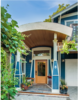Modern home with Exterior, House Building Type, Curved RoofLine, and Wood Siding Material. Arched Entry adds a bit of flare Photo of Massive Addition does not over-whelm