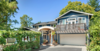 Modern home with Exterior, House Building Type, Wood Siding Material, and Curved RoofLine. After shot of the whole house Photo 2 of Massive Addition does not over-whelm
