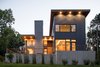 Modern home with Exterior, Shed RoofLine, House Building Type, Glass Siding Material, Wood Siding Material, Concrete Siding Material, and Metal Siding Material. The taller mass holds the sleeping spaces, while the living and gathering spaces are located in the lower elements. Photo 3 of Dogwood Residence