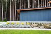 Modern home with Exterior, Shed RoofLine, and House Building Type. Grays and oranges compliment the natural tones of the site. Photo 5 of Dogwood Residence