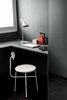 Modern home with Office, Study Room Type, Library Room Type, Craft Room Room Type, Chair, Bookcase, Storage, Shelves, Desk, Lamps, and Light Hardwood Floor. Home Office Photo of 17 Stellar Uses of Color in Home Offices