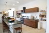 Modern home with Kitchen, Limestone Floor, Wood Cabinet, Marble Counter, Ceiling Lighting, and Ceramic Tile Backsplashe. The kitchen Photo 14 of A house in the mountains
