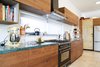 Modern home with Kitchen, Wood Cabinet, Limestone Floor, Ceiling Lighting, and Stone Counter. The kitchen Photo 15 of A house in the mountains