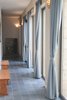 Modern home with Living Room, Bench, Concrete Floor, and Wall Lighting. The corridor overlooks the patio
Photo 17 of A house in the mountains