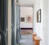 Modern home with Living Room, Bench, Concrete Floor, Floor Lighting, and Wall Lighting. The corridor overlooks the patio Photo 18 of A house in the mountains