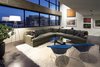 Modern home with Living Room, Sectional, Floor Lighting, Chair, Recessed Lighting, Coffee Tables, and Concrete Floor. living room - looking west at dusk Photo 2 of Governors Plaza