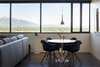 Modern home with Dining Room, Table, Chair, Pendant Lighting, and Concrete Floor. breakfast table looking at the wasatch mountain range Photo 3 of Governors Plaza
