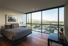 Modern home with Bedroom, Night Stands, Lamps, Table Lighting, Bed, Recessed Lighting, and Medium Hardwood Floor. guest bedroom - looking to wasatch mountain range beyond Photo 12 of Governors Plaza
