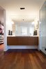 Modern home with Marble Counter, Vessel Sink, Enclosed Shower, Wall Lighting, Medium Hardwood Floor, Recessed Lighting, and Bath Room. master bathroom - vanity featuring crisp sconces by rich, brilliant, and willing Photo 15 of Governors Plaza