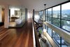 Modern home with Marble Counter, Recessed Lighting, Hallway, and Light Hardwood Floor. mezzanine - looking toward master bathroom and living below Photo 16 of Governors Plaza