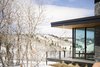 Modern home with Exterior, House Building Type, Metal Roof Material, Wood Siding Material, Stone Siding Material, Flat RoofLine, and Shed RoofLine. The viewing deck wraps around the home to provide views in every direction. Photo 5 of Red Hawk