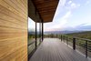 Modern home with Outdoor, Back Yard, Large Patio, Porch, Deck, Decking Patio, Porch, Deck, Wire Fences, Wall, Metal Fences, Wall, and Horizontal Fences, Wall. The sun has just set on this view of the Wasatch Mountain Range. Photo 9 of Red Hawk