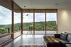 Modern home with Living Room, Ottomans, Sofa, Track Lighting, and Concrete Floor. Surrounded by views the living space offers both distant views of mountains and closer views of the ridge across the canyon. Photo 19 of Red Hawk