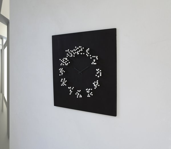 ”MOCAP “ wall clock
description: Most wall-clocks have the same basic shape: round. Also the same looking time-indication by numbers or stripes.
"MOCAP" steps away from the basic..
It's appearance leans more to a piece of conceptual art ,then to a basic time-telling clock.
The big wall clock will catch your eye by changing shape when you walk around it. When you stand in front of the clock: the numbers are clear and visible. When you walk around it: numbers slowly dissolve, and seem to fall apart in little floating white balls.
This optical illusion results in a striking and intriguing piece of wall-art. Inspired by "MOTION CAPTURE" technique used in movies such as" Lord of the rings"+"Avatar"

Design: J.P.Meulendijks for www.Planktonstation.nl
material: wood (recycled)
dimensions: Height: 79 cm. / 31 inch width: 79 cm./ 31 inch depth: 10 cm./ 4 inch .
color: Clock-face finished in matted black, causing the bright white balls to seemingly float in mid-air.
-Clock-hands finished in anthracite so they are subtle visible. against the matted black background .
