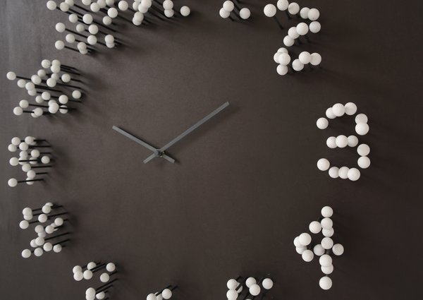 ”MOCAP “ wall clock
description: Most wall-clocks have the same basic shape: round. Also the same looking time-indication by numbers or stripes.
"MOCAP" steps away from the basic..
It's appearance leans more to a piece of conceptual art ,then to a basic time-telling clock.
The big wall clock will catch your eye by changing shape when you walk around it. When you stand in front of the clock: the numbers are clear and visible. When you walk around it: numbers slowly dissolve, and seem to fall apart in little floating white balls.
This optical illusion results in a striking and intriguing piece of wall-art. Inspired by "MOTION CAPTURE" technique used in movies such as" Lord of the rings"+"Avatar"

Design: J.P.Meulendijks for www.Planktonstation.nl
material: wood (recycled)
dimensions: Height: 79 cm. / 31 inch width: 79 cm./ 31 inch depth: 10 cm./ 4 inch .
color: Clock-face finished in matted black, causing the bright white balls to seemingly float in mid-air.
-Clock-hands finished in anthracite so they are subtle visible. against the matted black background .