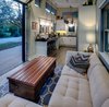 Interior of the main house, with custom-made Abaco wood coffee table Photo 2 of Amplified Tiny House modern home