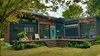 Modern home with Exterior, House Building Type, Wood Siding Material, and Metal Siding Material. Exterior of "Amplified" Tiny House. Exterior furniture by Ecovet Furniture. Their furniture is custom built by veterans using reclaimed material from decommissioned trailers. Photo 8 of Amplified Tiny House