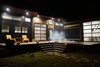 Modern home with Exterior, Metal Roof Material, Metal Siding Material, and Wood Siding Material. "Amplified" Tiny House at Night Photo 10 of Amplified Tiny House