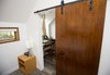 Modern home with Bedroom and Vinyl Floor. Calder - Interior 2 - Recycled Barn Door Photo 4 of Calder Laneway House - Edmonton