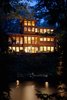 Nighttime view of house from Lake Luzerne Photo of Fourth Lake Summer House modern home