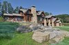 Sited to take advantage of scenic Saratoga Lake vistas, this residence is centered on a 3-story open stairway and double height living room, which together, along with the cupola, function as a thermal chimney for passive ventilation. Photo of LEED Silver House modern home