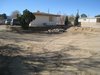Modern home with Outdoor, Front Yard, and Desert. Photo showing front of building with dirt removed from front of building for future block wall. This block wall will make the building seem taller than the one story it is now. Photo 4 of Modern Jewel in the Desert