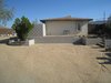 Modern home with Outdoor, Front Yard, Horizontal Fences, Wall, Concrete Patio, Porch, Deck, and Hardscapes. Building with block wall added. Photo 5 of Modern Jewel in the Desert