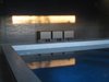 Modern home with Outdoor, Small Pools, Tubs, Shower, and Concrete Pools, Tubs, Shower. What once was a carport is now an indoor pool. Photo 9 of Modern Jewel in the Desert