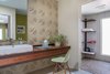 Modern home with Bath Room, Porcelain Tile Floor, Vessel Sink, Wood Counter, Open Shower, Ceiling Lighting, and One Piece Toilet. Cardboard tiles are a really inexpensive way to tile a wall for maximum effect and hardly any cost. Photo 18 of Modern Jewel in the Desert